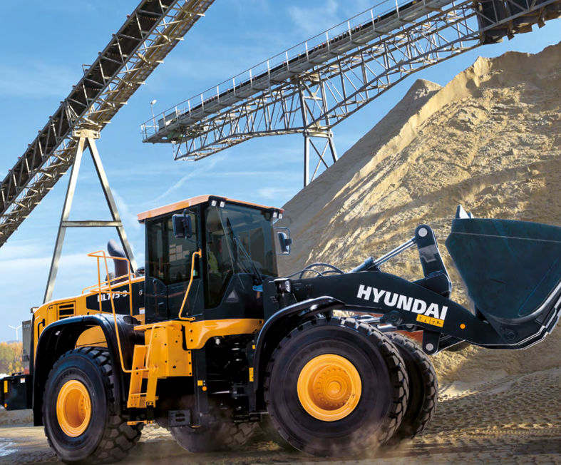 wheel loader lifting gravel in a rocky construction site